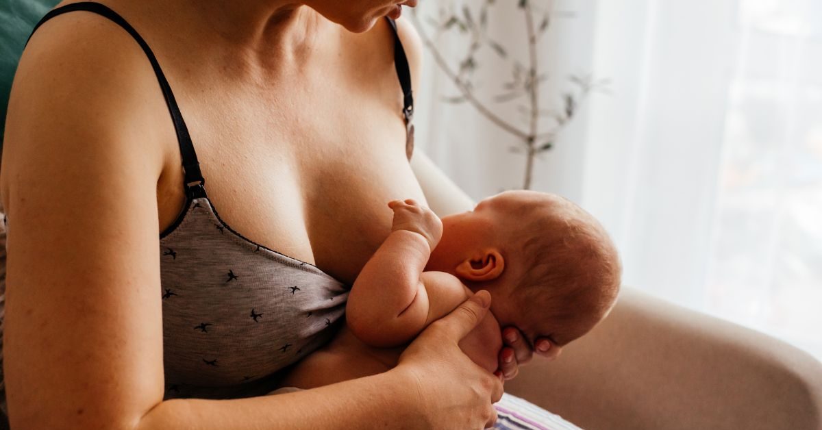 mother breastfeeding newborn