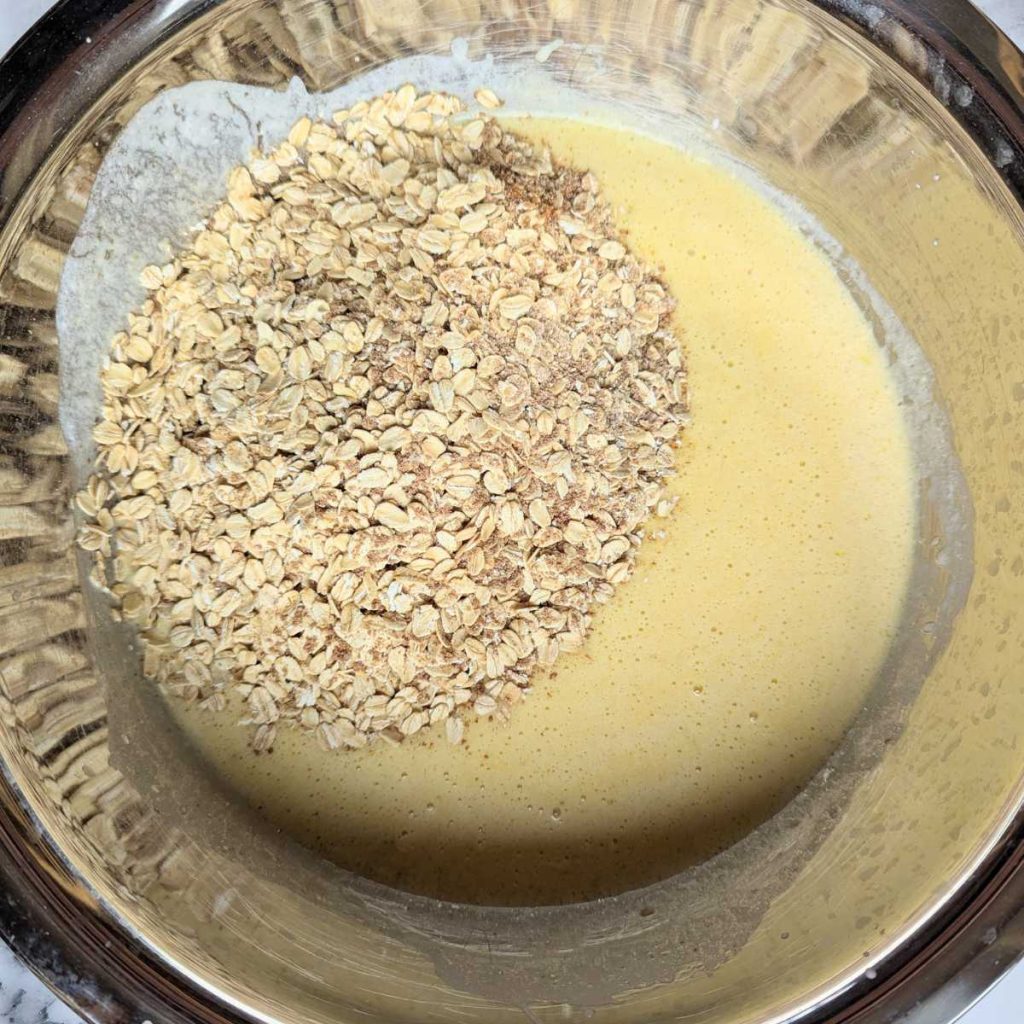 oats and wet ingredients in mixing bowl