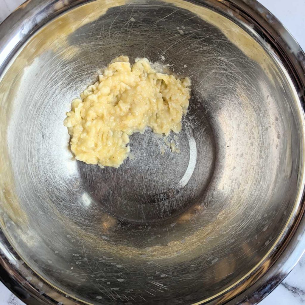 one mashed banana in a bowl