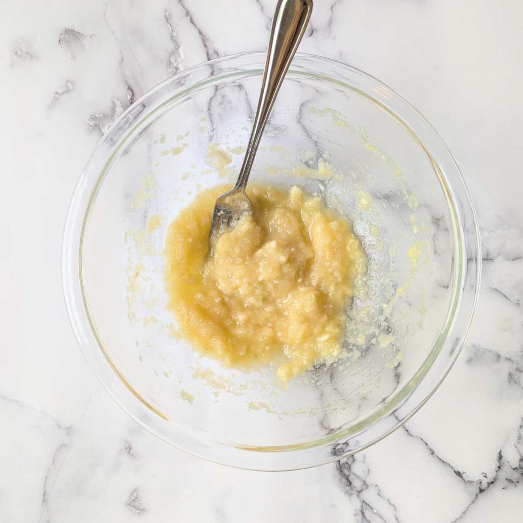 mashed banana, applesauce in mixing bowl