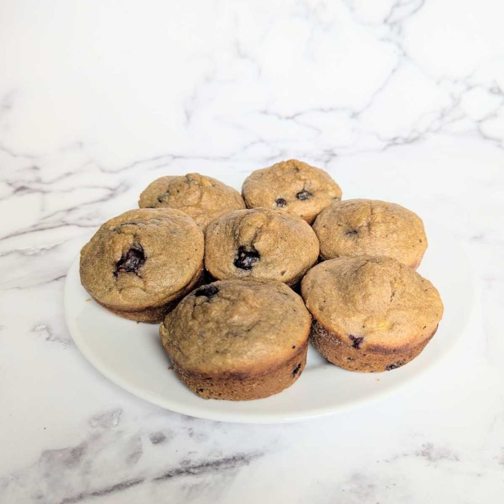 7 whole wheat blueberry muffins with no sugar on plate