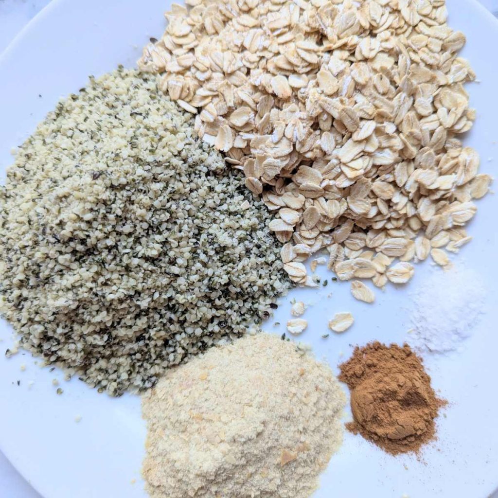 oatmeal, almond flour and other ingredients for chickpea protein bars on a plate