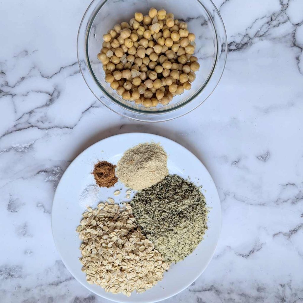 chickpeas in a bowl next to ingredients on a plate